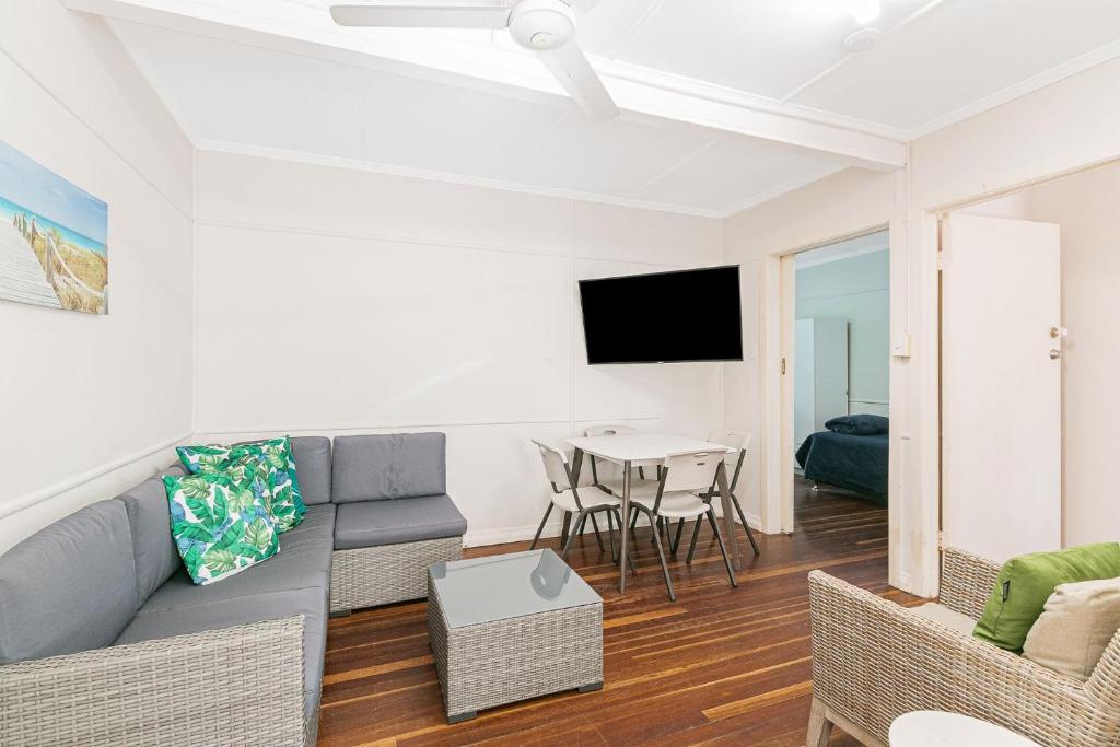 a living room with a couch and a table at Tondio Terrace Flat 5 - Pet Friendly in Gold Coast