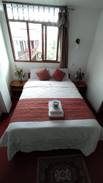 Postel nebo postele na pokoji v ubytování Hotel Kuelap Chachapoyas