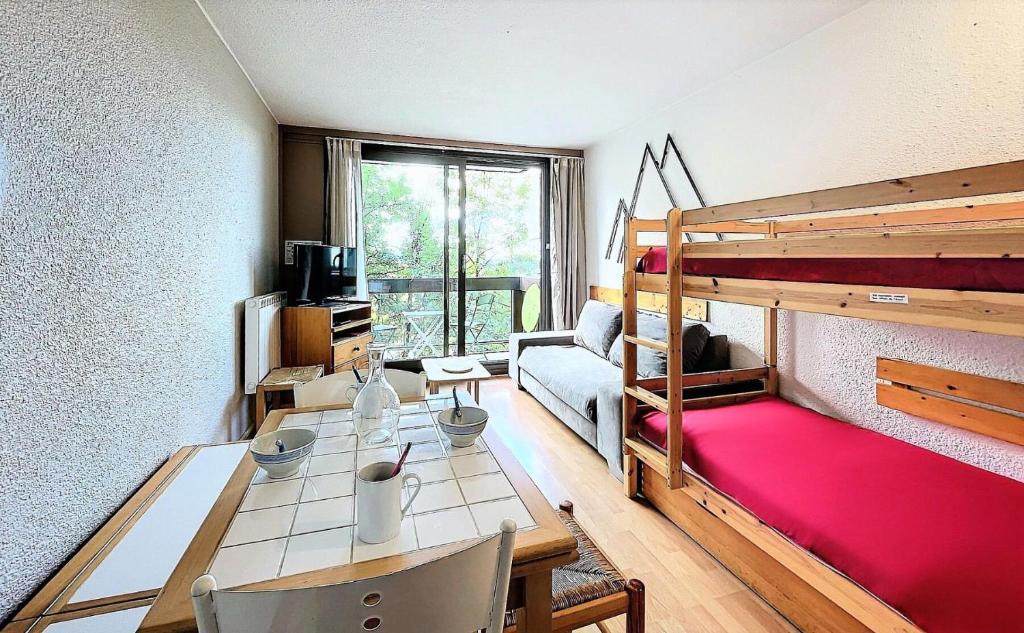 En eller flere senge i et værelse på Résidence Pegase - STUDIO 4 PERSONNES MAE-0631