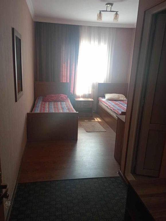 Voodi või voodid majutusasutuse Hotel Nikea Paradiso toas