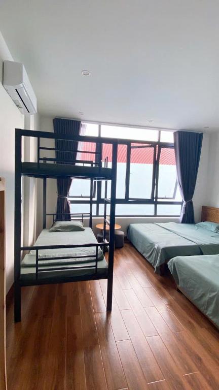 Postel nebo postele na pokoji v ubytování LavA homestay