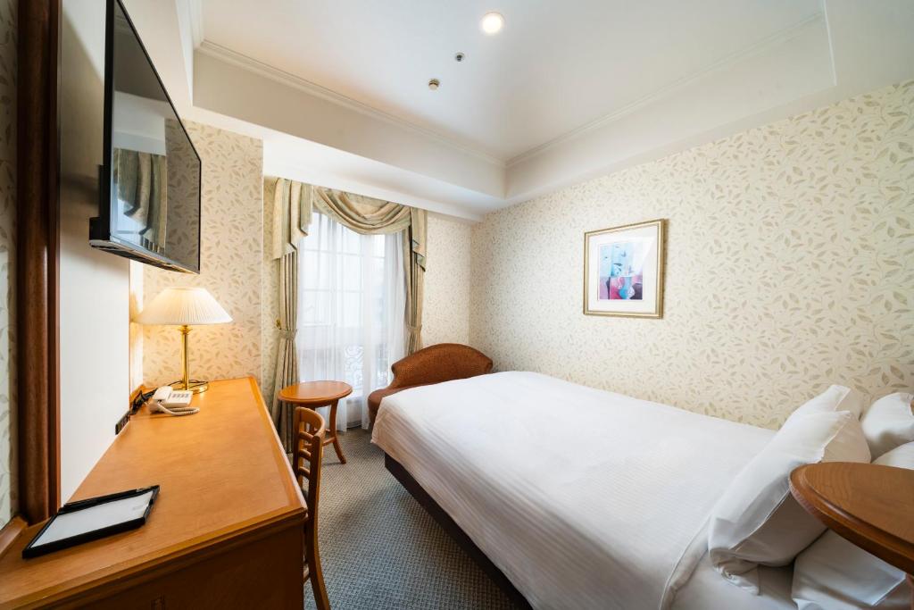 TV a/nebo společenská místnost v ubytování KOKO HOTEL Osaka Shinsaibashi