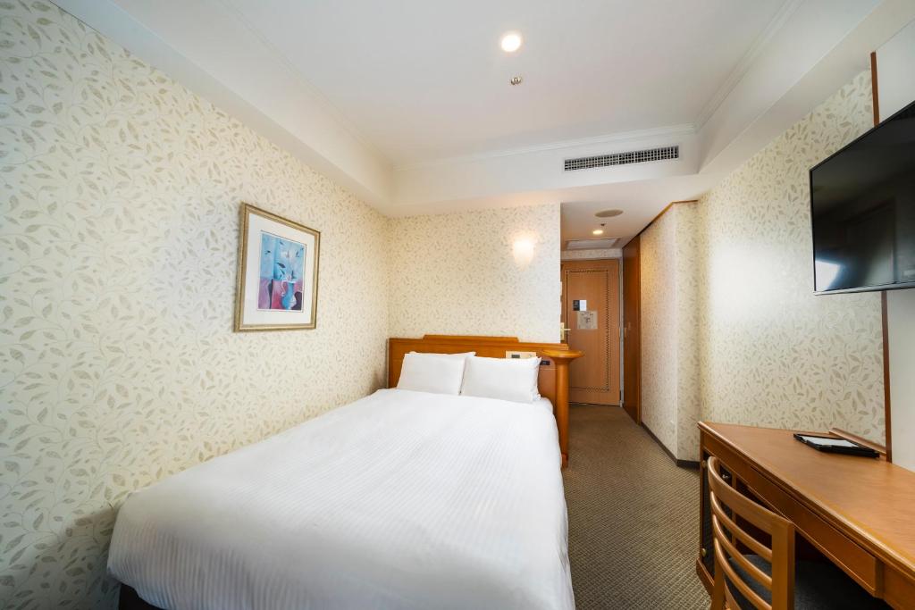 TV a/nebo společenská místnost v ubytování KOKO HOTEL Osaka Shinsaibashi