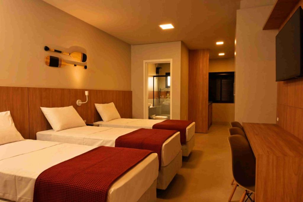 Cama ou camas em um quarto em Pousada Caminho do Bosque