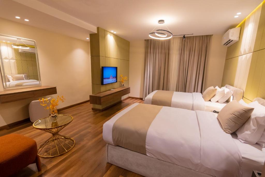 Voodi või voodid majutusasutuse Spire West Hotel toas