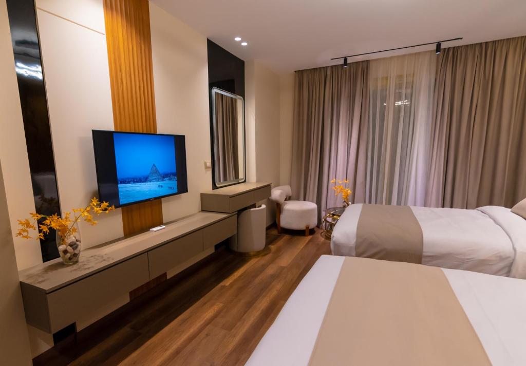 Voodi või voodid majutusasutuse Spire West Hotel toas