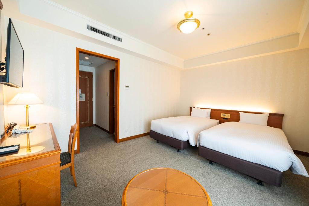 Postel nebo postele na pokoji v ubytování KOKO HOTEL Osaka Shinsaibashi
