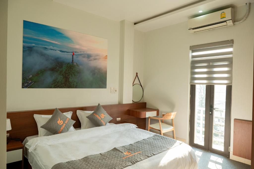 Postel nebo postele na pokoji v ubytování Garden Hotel II