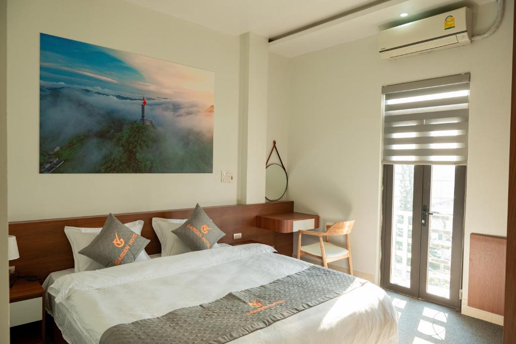 Postel nebo postele na pokoji v ubytování Garden Hotel II