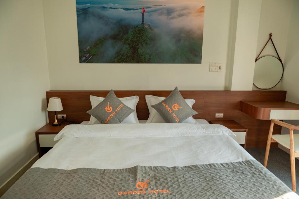 Postel nebo postele na pokoji v ubytování Garden Hotel II