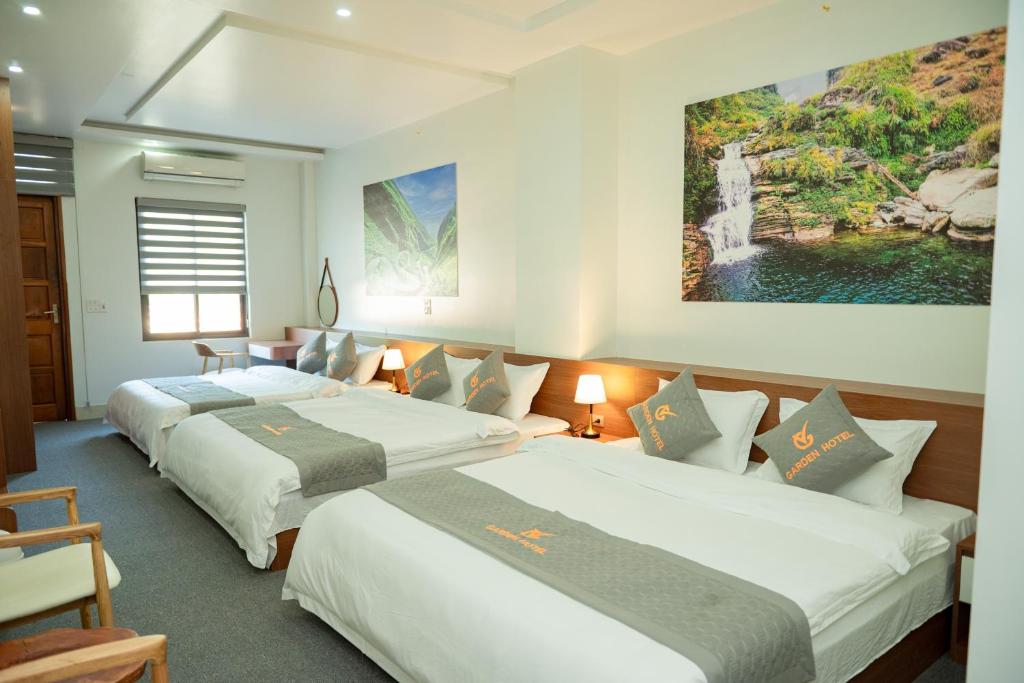 Postel nebo postele na pokoji v ubytování Garden Hotel II