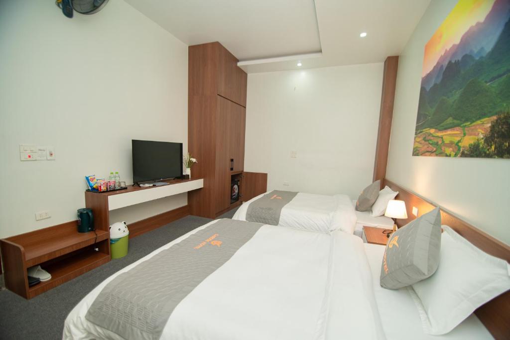 Postel nebo postele na pokoji v ubytování Garden Hotel II