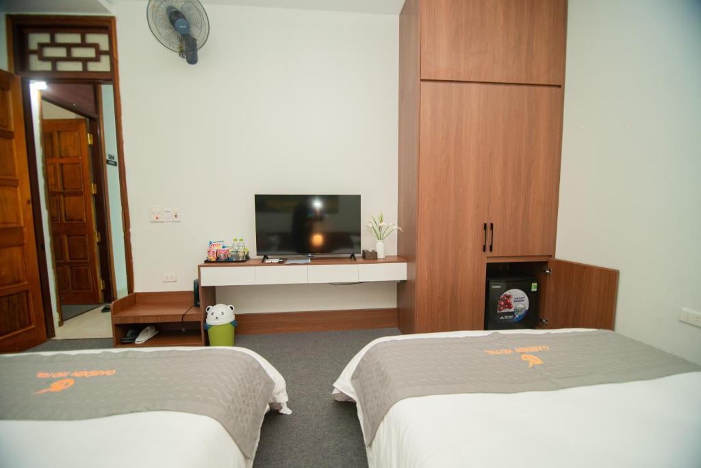 Postel nebo postele na pokoji v ubytování Garden Hotel II