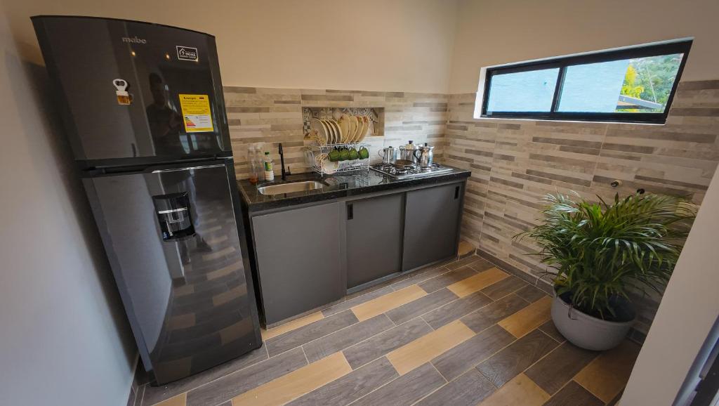 Kuchyň nebo kuchyňský kout v ubytování Hermoso apartamento familiar con parqueadero