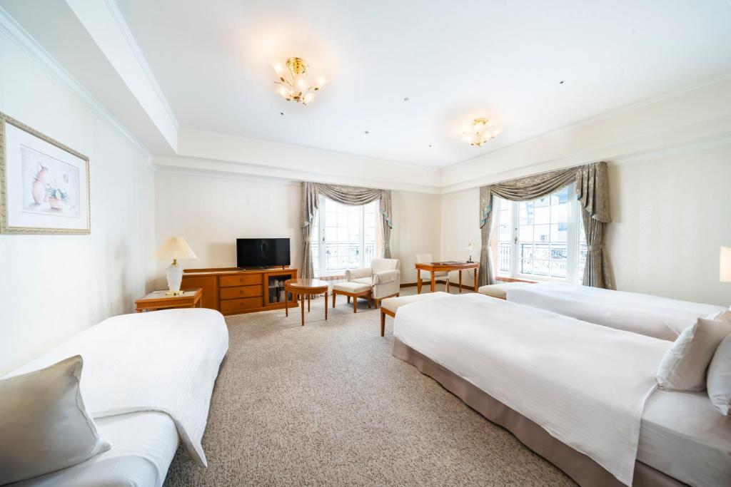 Postel nebo postele na pokoji v ubytování KOKO HOTEL Osaka Shinsaibashi