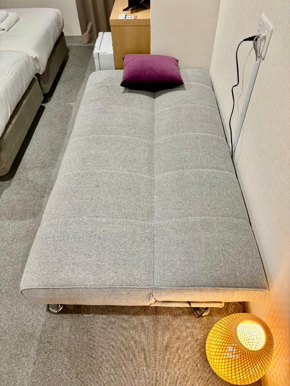 Postel nebo postele na pokoji v ubytování Y&Y NAMBA HOTEL Osaka