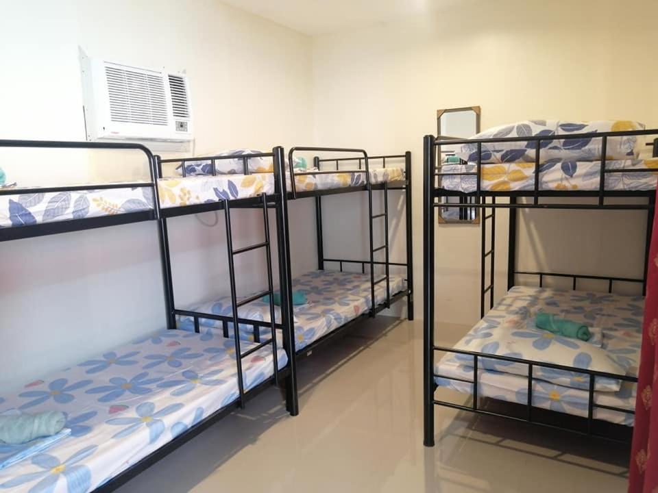 Postel nebo postele na pokoji v ubytování Chef Panyang Beach Resort Okoy
