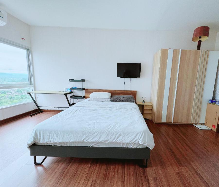 Postel nebo postele na pokoji v ubytování supalai monte II swimming condo