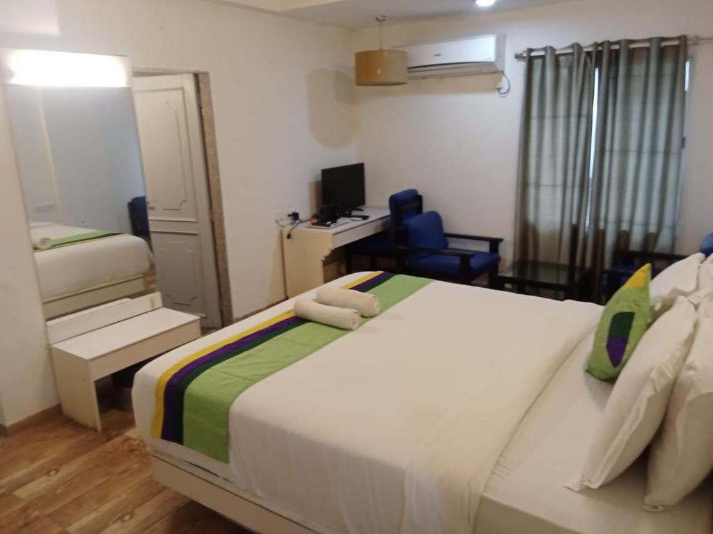 Postel nebo postele na pokoji v ubytování Hotel Crown