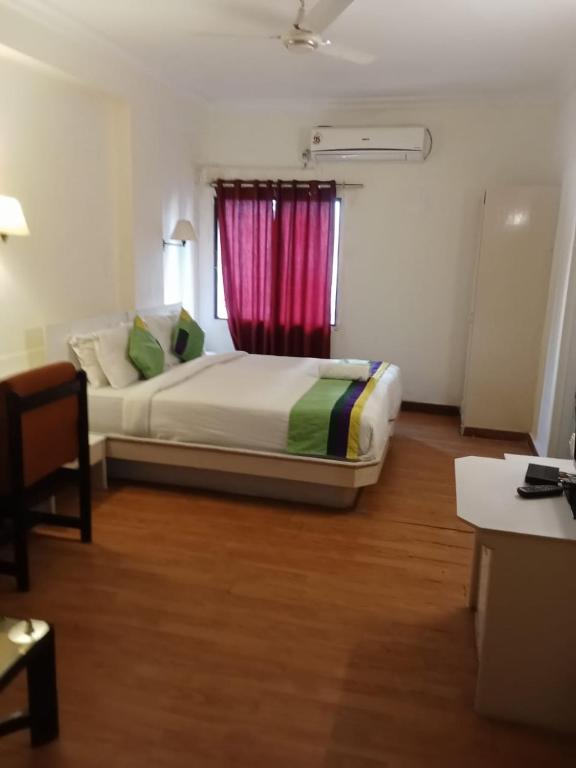 Postel nebo postele na pokoji v ubytování Hotel Crown