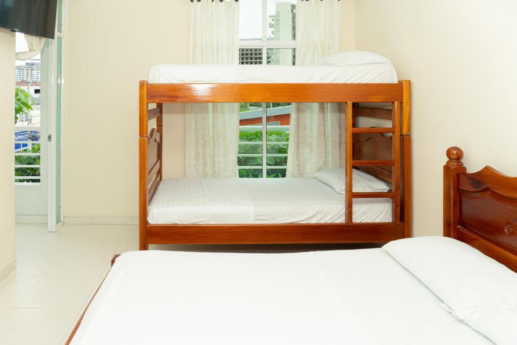 Postel nebo postele na pokoji v ubytování HOTEL GAIRA MAR