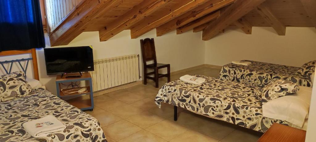 Postel nebo postele na pokoji v ubytování ALTOGREDOS Hotel Rural y apartamentos turísticos
