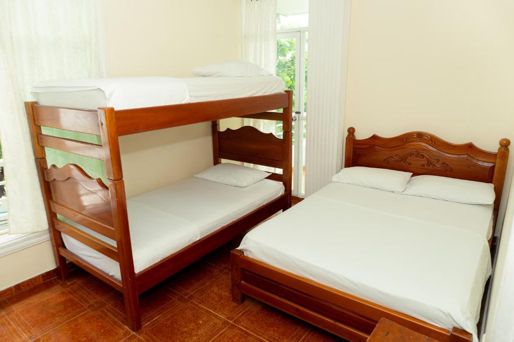 Postel nebo postele na pokoji v ubytování HOTEL GAIRA MAR