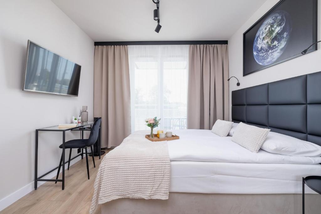 Posteľ alebo postele v izbe v ubytovaní Saska Blu Studios Premium by Noclegi Renters