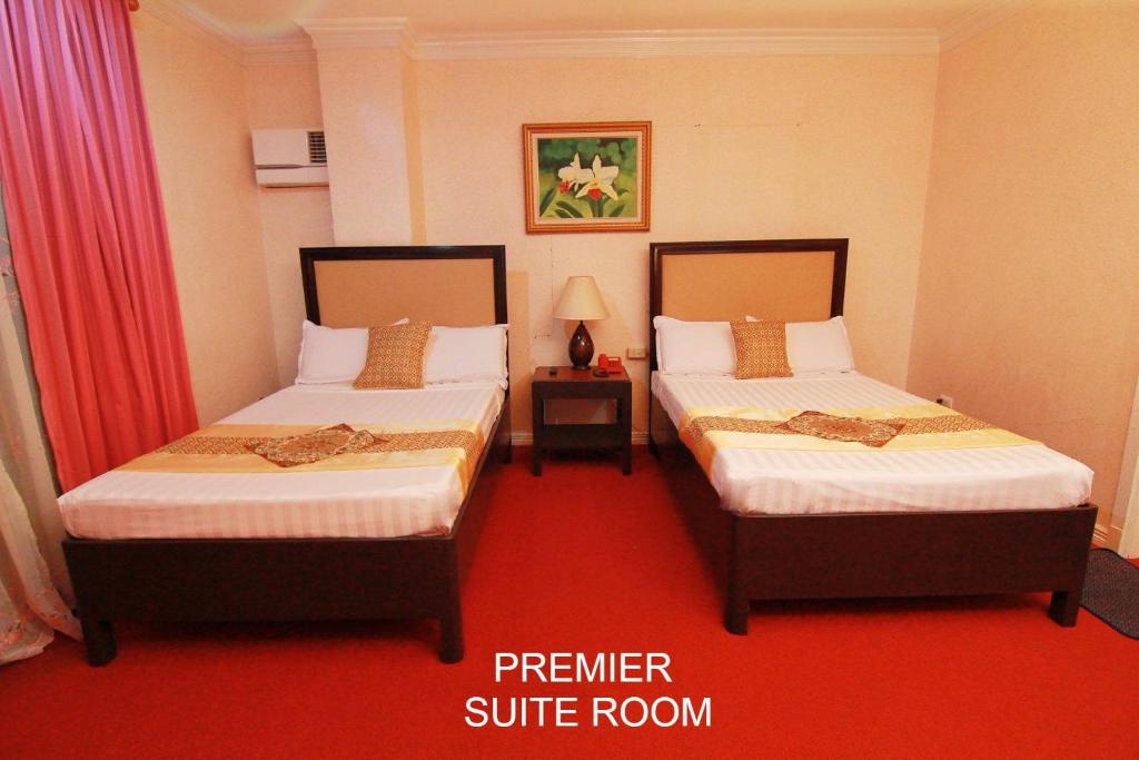Postel nebo postele na pokoji v ubytování PATIO RIZAL HOTEL Inc