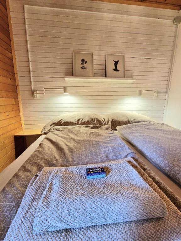 Postel nebo postele na pokoji v ubytování Forest Apartments Pokljuka