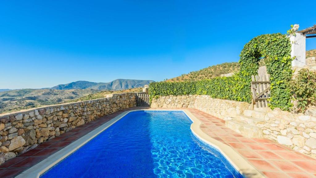 The swimming pool at or close to Casa El Pajar del Gastor by Ruralidays