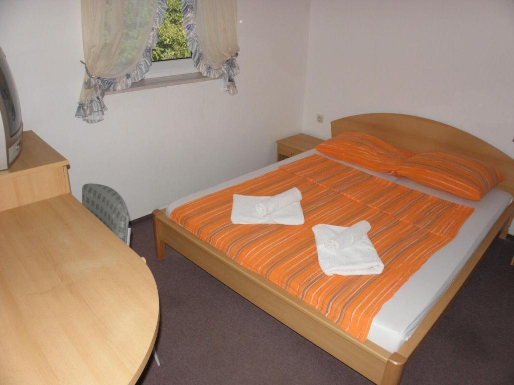 Postel nebo postele na pokoji v ubytování Apartments Monika