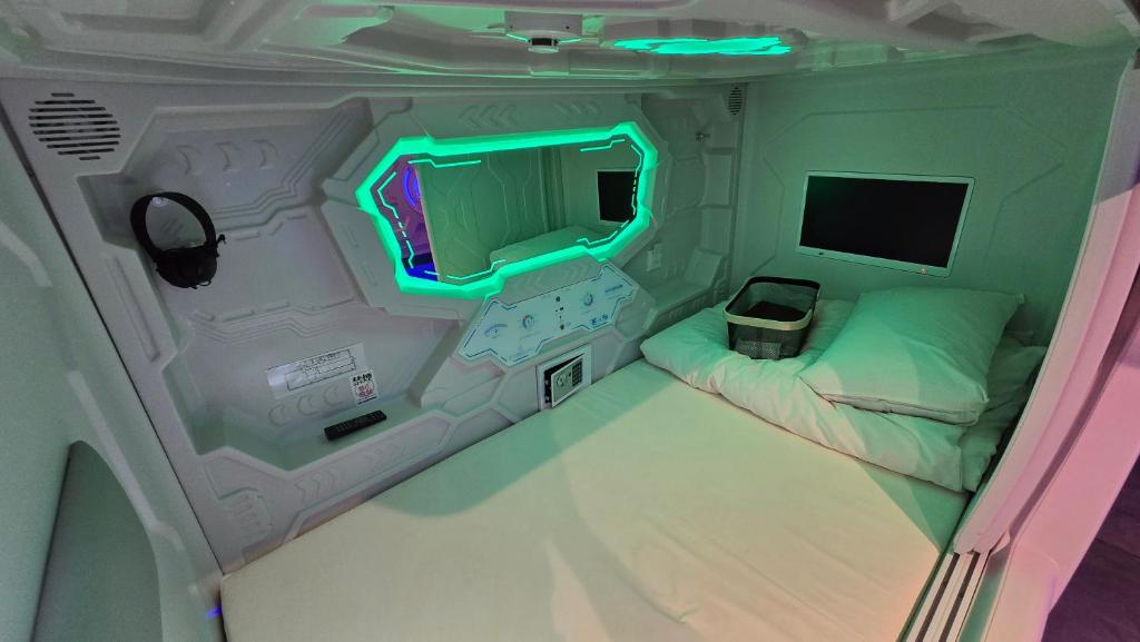 Postel nebo postele na pokoji v ubytování Hotel Galaxy Pod