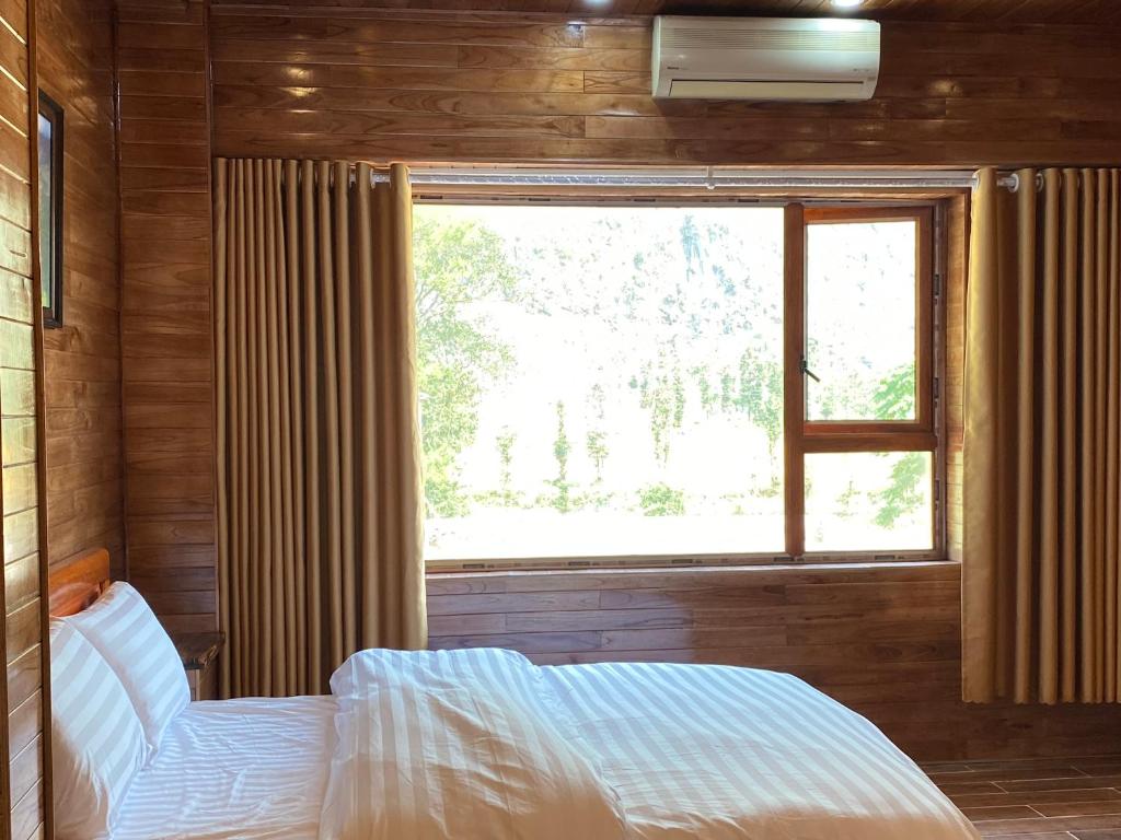 Postel nebo postele na pokoji v ubytování Cao nguyên đá homestay mèo vạc