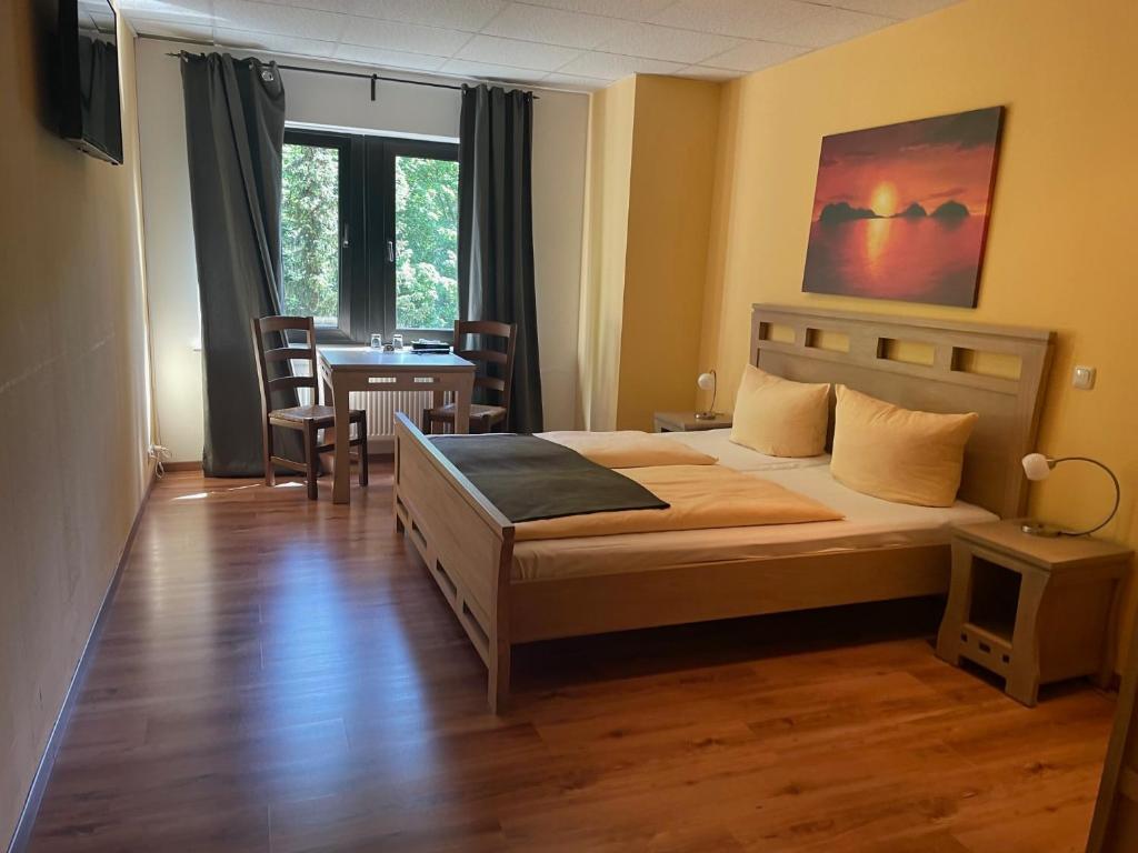 Postel nebo postele na pokoji v ubytování Hotel Rabenstein