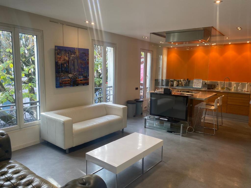 Χώρος καθιστικού στο Loft New Yorkais in Paris Bercy