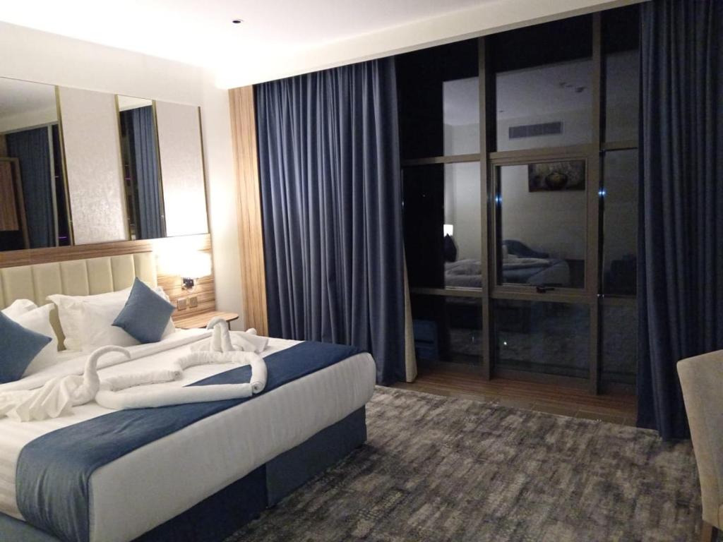 Postel nebo postele na pokoji v ubytování ALHYAT Hotel - فندق الحياة