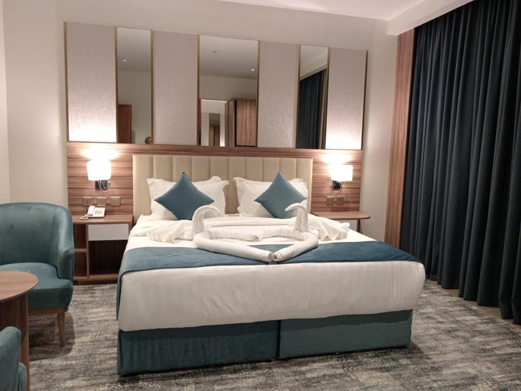 Postel nebo postele na pokoji v ubytování ALHYAT Hotel - فندق الحياة