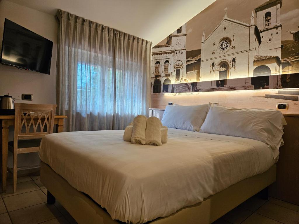 Postel nebo postele na pokoji v ubytování Hotel Cladan