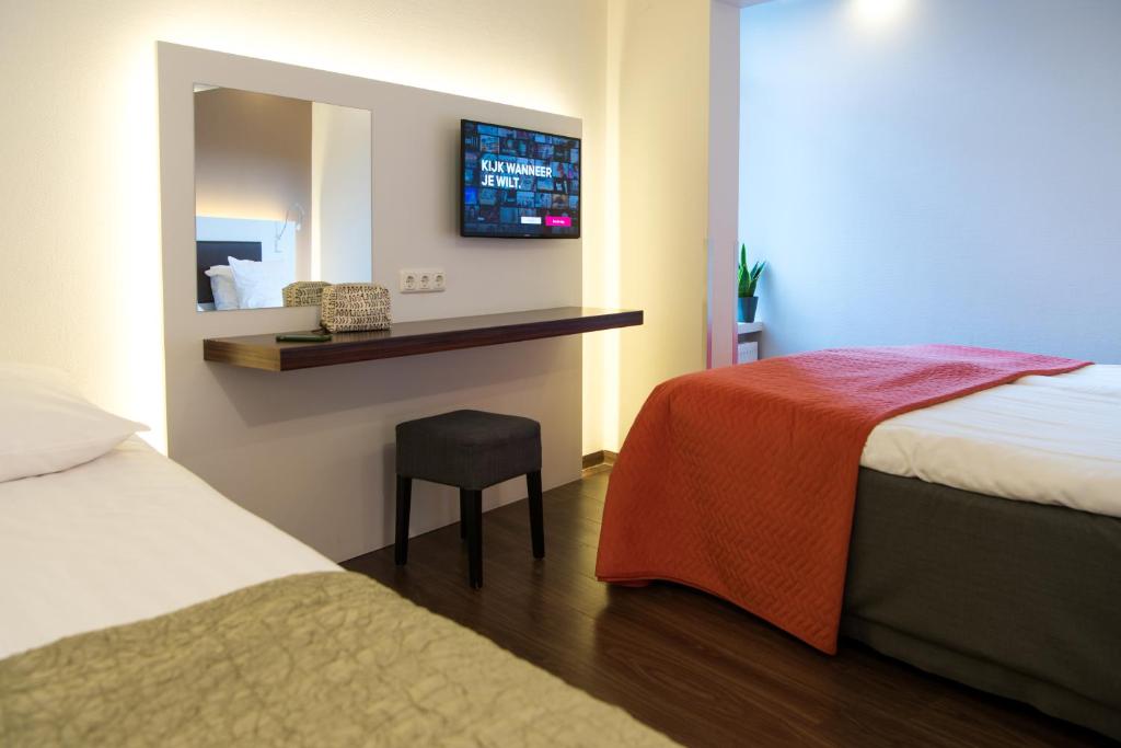 Letto o letti in una camera di Hotel Emma
