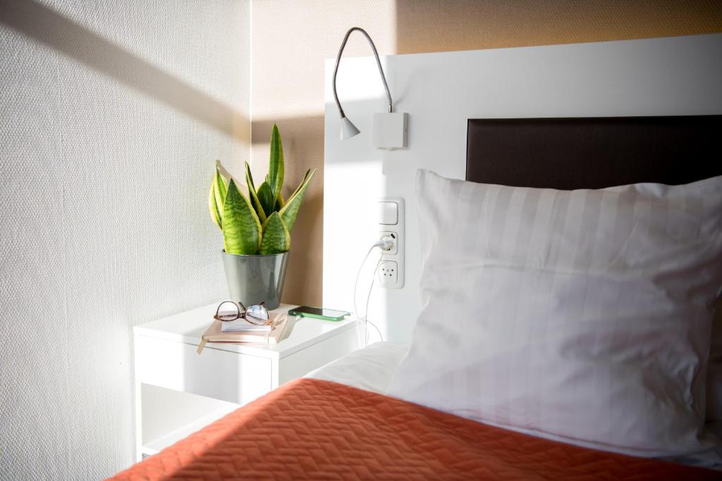 Letto o letti in una camera di Hotel Emma