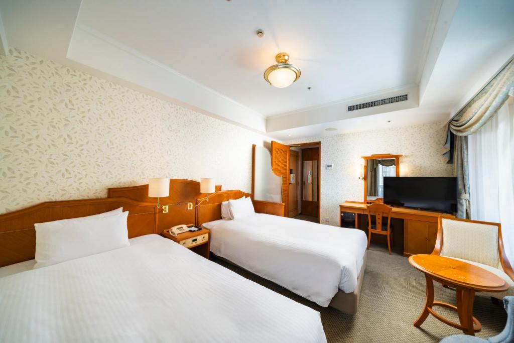 Postel nebo postele na pokoji v ubytování KOKO HOTEL Osaka Shinsaibashi