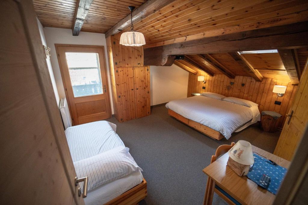 Łóżko lub łóżka w pokoju w obiekcie B&B Bucaneve