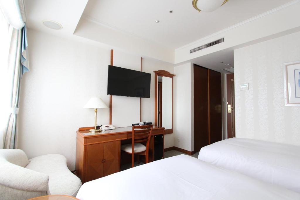 Postel nebo postele na pokoji v ubytování KOKO HOTEL Osaka Shinsaibashi