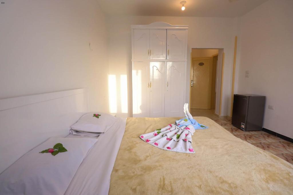 Postel nebo postele na pokoji v ubytování Luxor View Hostel