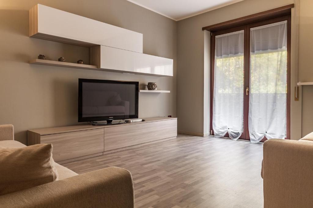Televízia a/alebo spoločenská miestnosť v ubytovaní Cardinal massaia venice apartment