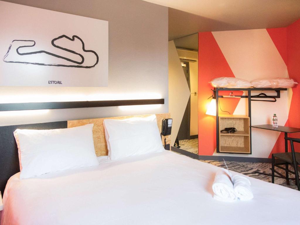 Postel nebo postele na pokoji v ubytování ibis Styles Bâle-Mulhouse Aéroport