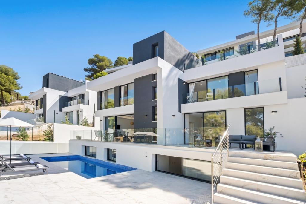 an image of a house with a swimming pool at Villas Pinares de San Anton - Sea, City, Mountain, Views in Málaga
