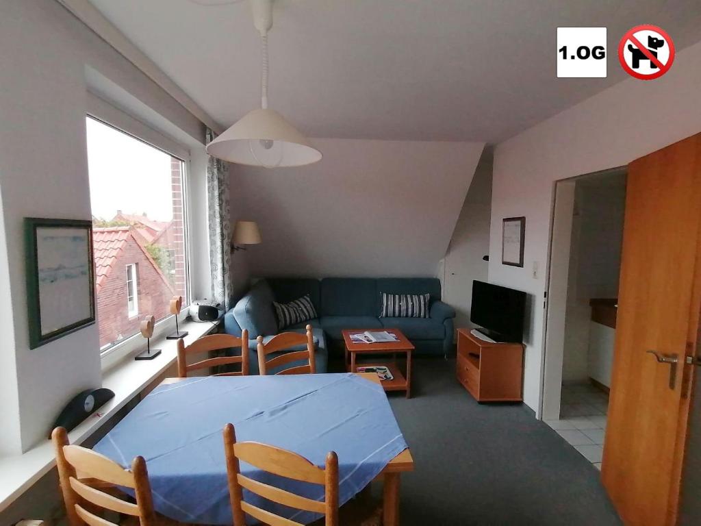 TV a/nebo společenská místnost v ubytování Gästehaus am Deich