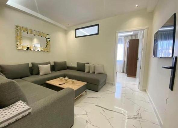 a living room with a couch and a table at Appartement Centre ville Tanger in Tangier